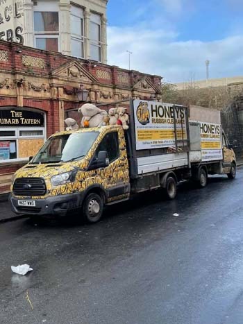 Honeys Rubbish Clearance trucks in Bristol, with teddy bears on the cab